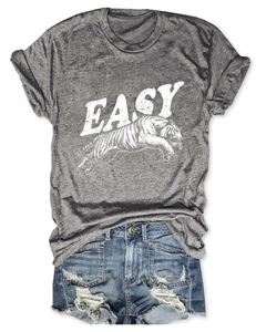 Detailed flat lay of a grey cotton T-shirt with tiger print and distressed denim shorts
