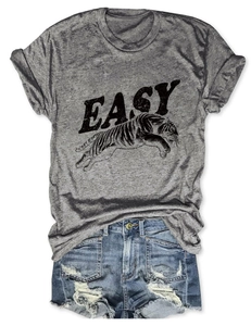 Flat lay of a grey T-shirt with tiger print and distressed denim shorts summer set