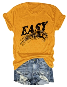 Detail of yellow cotton t-shirt with EASY tiger print and distressed denim shorts