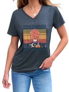 Detail of V-neck t-shirt with Take Chances Make Mistakes graphic on grey knit fabric