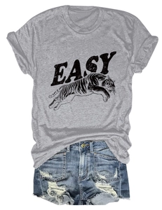 Detail showing vintage EASY tiger print on grey cotton t-shirt and ripped denim shorts