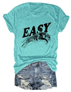 Detail of blue t-shirt with tiger print and distressed denim shorts with frayed edges