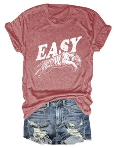 Flat lay of brick red cotton T-shirt with tiger print and distressed denim shorts