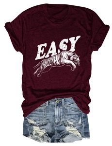 Detail of burgundy graphic t-shirt with EASY tiger print and distressed denim shorts