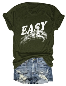 Detail of army green t-shirt with tiger print and distressed denim shorts ensemble