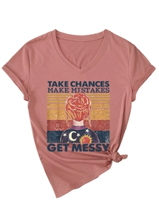 Detail of V-neck dusty pink T-shirt with vintage comic print and stylish front hem knot