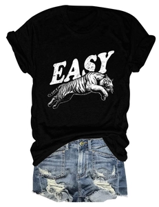 Close-up of tiger print and EASY lettering on black cotton T-shirt with denim shorts
