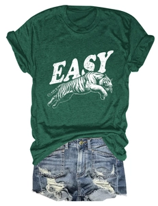 Flat lay of dark green T-shirt with tiger print and distressed blue denim shorts