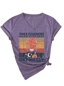 Detail of purple V-neck T-shirt with vintage graphic print and stylish front knot hem