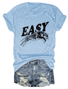 Close-up of short sleeve t-shirt with tiger print and distressed denim shorts