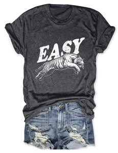 Flat lay of a heathered grey graphic T-shirt with tiger print and distressed denim shorts