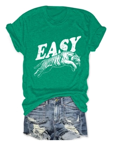 Flat lay of green round neck T-shirt with tiger print and frayed denim shorts
