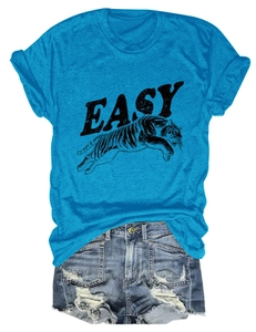 Flat lay of lake blue t-shirt with tiger print and distressed denim shorts set
