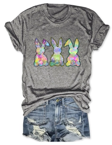 Detail of grey t-shirt with three colorful ink-splash rabbits and ripped denim shorts
