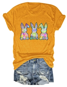 Detail of colorful watercolor bunny prints on casual yellow short-sleeve t-shirt cotton fabric