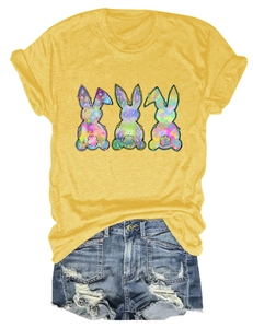 Detail of artistic colorful rabbit print on ginger yellow cotton t-shirt with denim shorts