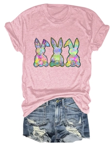 Detail of pink cotton T-shirt featuring three colorful artistic rabbit graphics