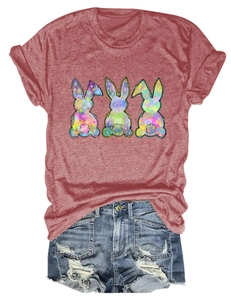 Detail of mauve T-shirt featuring three rainbow bunnies and distressed denim shorts