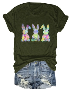 Detail of dark green t-shirt featuring three colorful bunny silhouettes and denim shorts