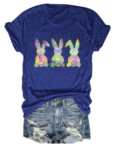 Detail of three colorful bunny prints on a navy blue cotton short sleeve t-shirt