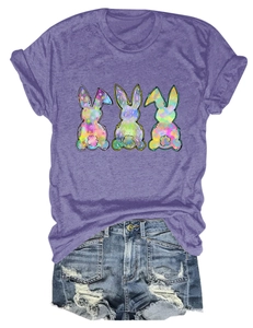 Detail of purple cotton T-shirt featuring three colorful tie-dye bunny silhouettes