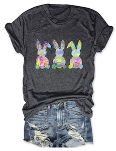 Flat lay of gray T-shirt with colorful rabbit prints and distressed denim shorts