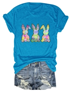 Peacock blue T-shirt with colorful rabbits and distressed denim shorts street style set