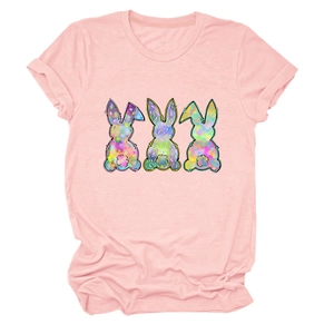 Close-up of pink women's T-shirt with three colorful tie-dye rabbit prints on chest