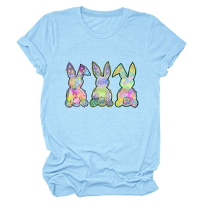 Light blue crewneck t-shirt featuring three colorful cartoon bunnies with artistic textures