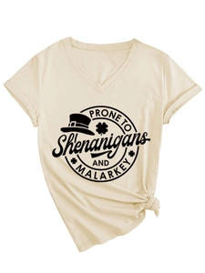 Detail of V-neck T-shirt showing knotted hem and St. Patrick's Day graphic print