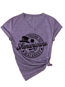 Detail of lilac V-neck t-shirt featuring Shenanigans print and side knot design