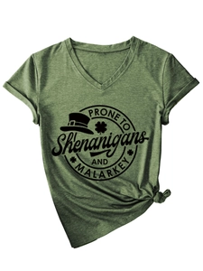 Detail of St. Patrick's Day graphic and side knot on dark green V-neck cotton T-shirt