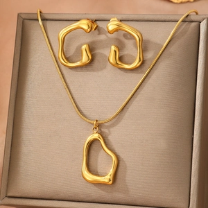 Golden titanium steel jewelry set featuring irregular geometric pendant and stud earrings
