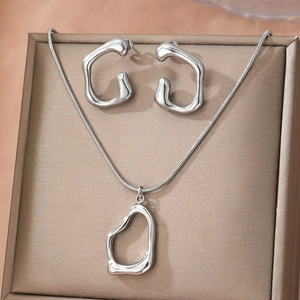 Minimalist silver titanium steel jewelry set featuring a lava-style necklace and earrings