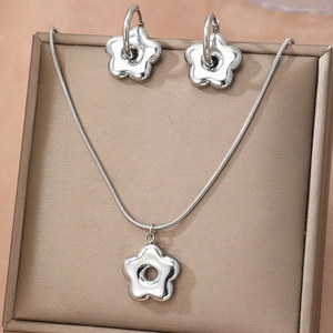 Elegant stainless steel floral jewelry set with necklace and earrings in a gift box