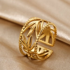 Elegant gold open leaf ring with bead edges on a silk background for women