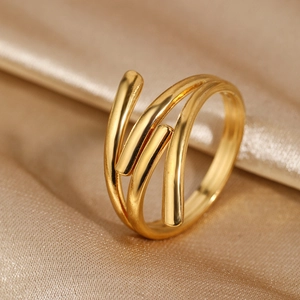 Close-up of 18k gold-plated stainless steel multilayer ring on champagne silk fabric