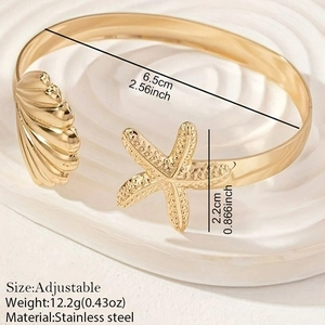 Gold stainless steel adjustable bangle featuring starfish and seashell marine elements
