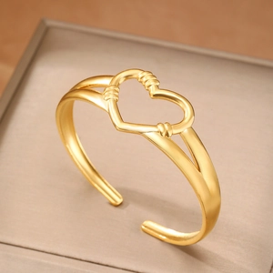 Bracciale rigido minimalista in acciaio inossidabile placcato oro 18k con cuore cavo