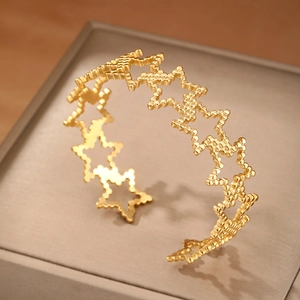 18K gold-plated stainless steel open bracelet with hollowed-out beaded star design