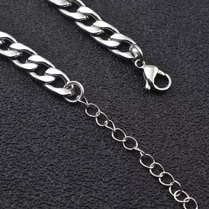Silver stainless steel Cuban link bracelet with lobster clasp on a black background