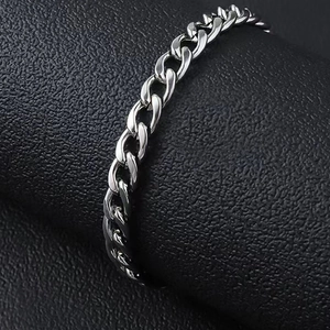 Polished silver stainless steel Cuban link bracelet for men on black leather base
