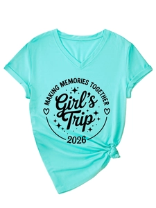 Detail of mint green V-neck t-shirt featuring Girl's Trip print and side knot design