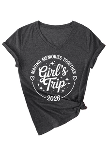Detail of dark charcoal V-neck t-shirt with front knot hem and Girl's Trip 2026 print