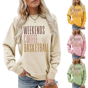 Detail of loose-fit round neck sweatshirts in cream yellow pink and green with graphic print