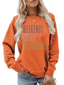 Detail of bright orange crewneck sweatshirt with gradient weekends coffee text print