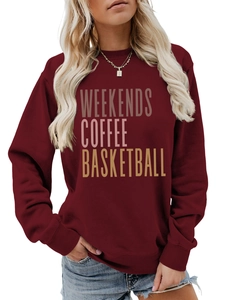 Close-up of burgundy crew neck sweatshirt with Weekends Coffee Basketball print