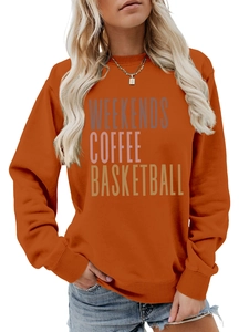 Detail of printed text weekends coffee basketball on orange long sleeve sweatshirt
