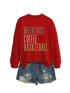 Flat lay of red sweatshirt with Weekends Coffee print and distressed denim shorts