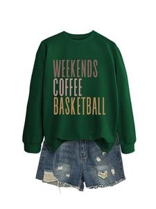 Detail of green crewneck sweatshirt with Weekends Coffee print and distressed denim shorts